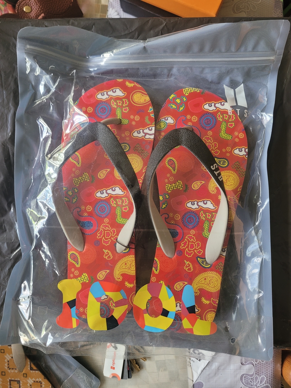 Colorful Red Patterned Flip Flops with Black Straps
